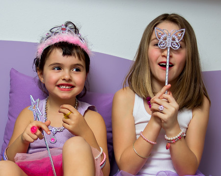 Portrait of two little girls dressed in princessの写真素材