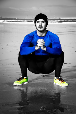 Young athlete training  on the beachの写真素材