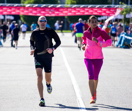 GIJON, SPAIN - MAY 2014: Participants in the annual half marathon in the city of Gijon, Spain, on Saturday, May 3, 2014.のeditorial素材