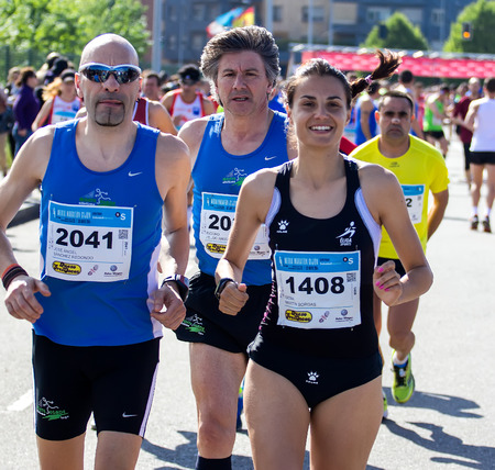 GIJON, SPAIN - MAY 2014: Participants in the annual half marathon in the city of Gijon, Spain, on Saturday, May 3, 2014.のeditorial素材