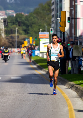 GIJON, SPAIN - MAY 2014: Participants in the annual half marathon in the city of Gijon, Spain, on Saturday, May 3, 2014.のeditorial素材