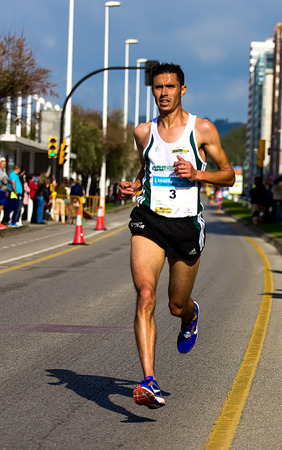 GIJON, SPAIN - MAY 2014: Participants in the annual half marathon in the city of Gijon, Spain, on Saturday, May 3, 2014.のeditorial素材