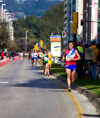 GIJON, SPAIN - MAY 2014: Participants in the annual half marathon in the city of Gijon, Spain, on Saturday, May 3, 2014.のeditorial素材