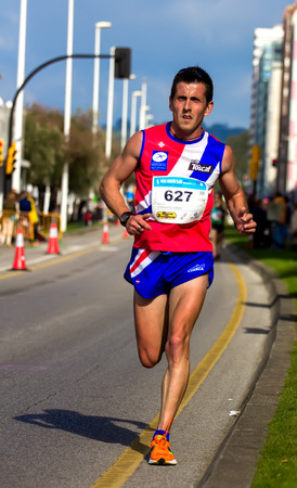 GIJON, SPAIN - MAY 2014: Participants in the annual half marathon in the city of Gijon, Spain, on Saturday, May 3, 2014.のeditorial素材