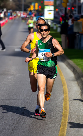 GIJON, SPAIN - MAY 2014: Participants in the annual half marathon in the city of Gijon, Spain, on Saturday, May 3, 2014.のeditorial素材