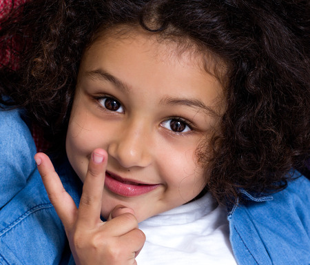 Portrait of a little girl looking at cameraの写真素材