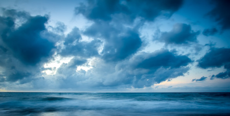 View of a rocky coast in the sunset. Long exposure shot.