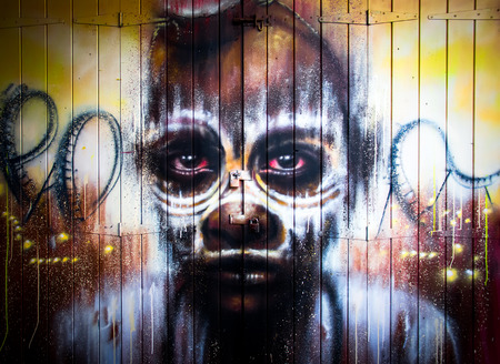 London, June 2014 - urban graffiti near Camden Lock Market. The work is a drawing portrait of man by an unknown artistのeditorial素材