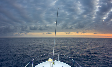 Yacht sailing in the immensityの写真素材