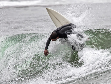 Man surfing a wave in the sea