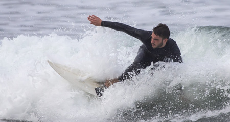 Man surfing a wave in the sea