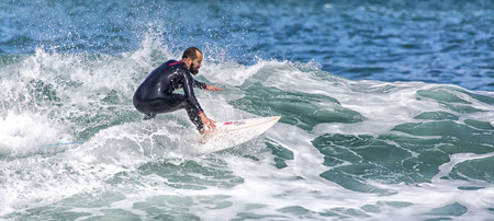 LLANES, SPAIN  May, 2015: Surfer participating in the CACONTEST 2015 on Ballota beach located in Asturias, in the north of Spain. May, 16, 2015のeditorial素材