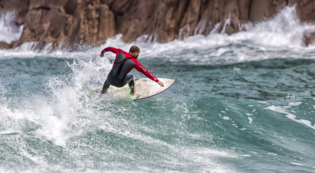 LLANES, SPAIN  May, 2015: Surfer participating in the CACONTEST 2015 on Ballota beach located in Asturias, in the north of Spain. May, 16, 2015のeditorial素材