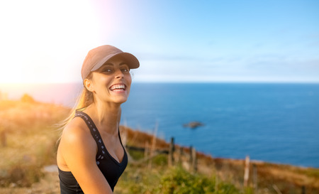 Portrait of a beautiful fitness woman outdoorsの写真素材