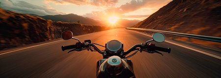 Motorcyclist speeding down the roadの素材
