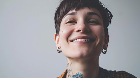 Portrait of a happy middle-aged woman looks in camera on white background.の素材