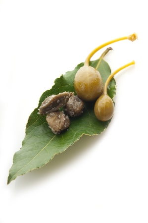 capers over leafの写真素材