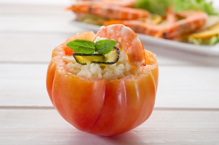 open tomato with couscous shrimp and zucchinisの写真素材