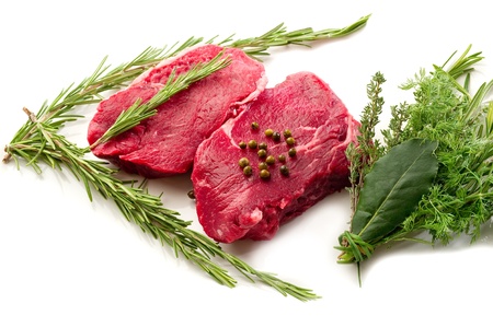 raw tenderloin with herbsの写真素材