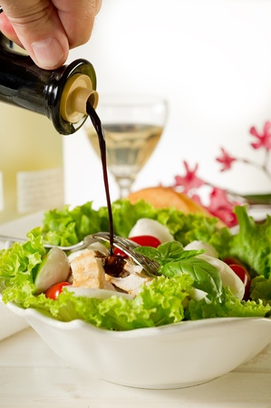 mixed salad with grilled chicken breast and cherry mozzarellaの写真素材