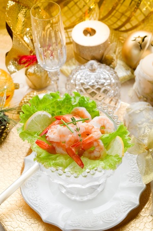 shrimp cocktail on golden tableの写真素材