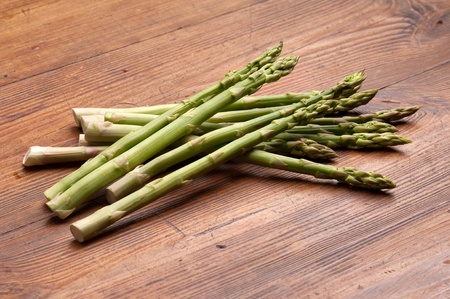 asparagus on wood backgroundの写真素材