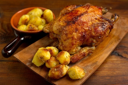 roasted chicken with potatoesの写真素材