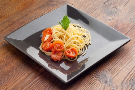 spaghetti with  sliced  tomatoesの写真素材