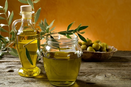 olive oil on wood backgroundの写真素材
