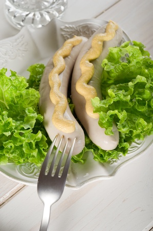 wurstel with green saladの写真素材