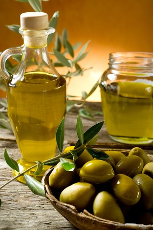 olive oil on wood backgroundの写真素材