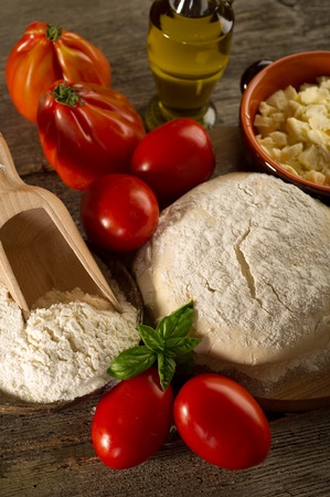 dough and ingredients for homemade pizzaの写真素材