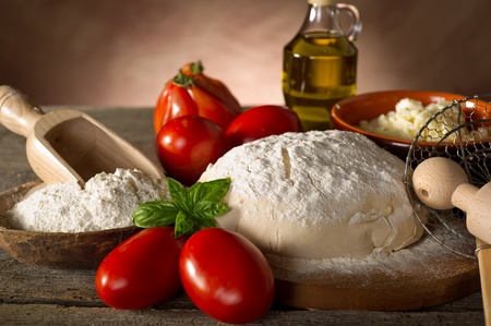 dough and ingredients for homemade pizzaの写真素材