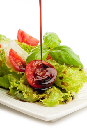 balsamic vinegar over saladの写真素材