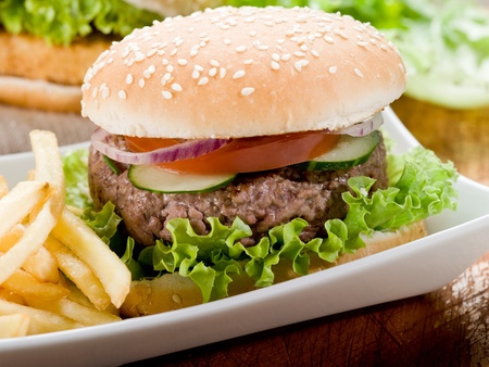 sandwich with hamburger and fried potatoesの写真素材