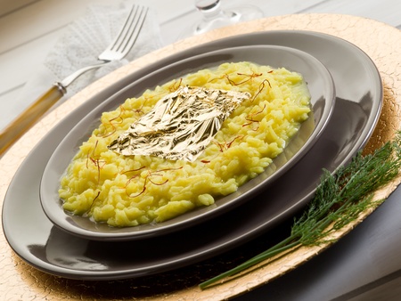 saffron risotto with gold leaf の写真素材