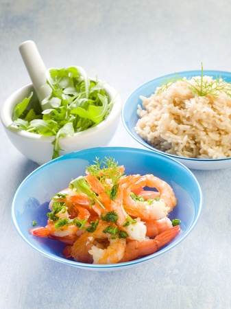 shrimp with rice and arugulaの写真素材