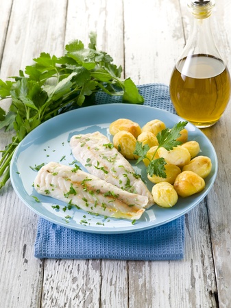 steamed cod with parsley and potatoesの写真素材