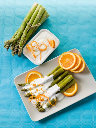 asparagus with yogurt cream sauce and orange peelの写真素材