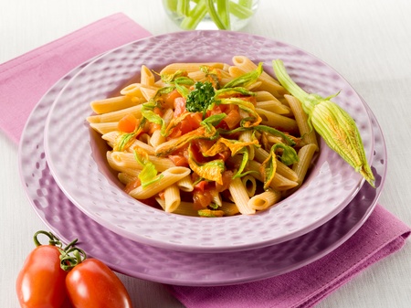pasta with zucchinis flower and fresh tomatoes,healthy foodの写真素材