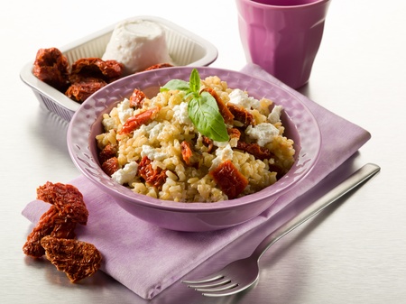 brown rice with ricotta and dried tomatoesの写真素材