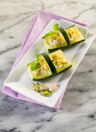 basket of stuffed zucchinis with ricotta and pistachioの写真素材