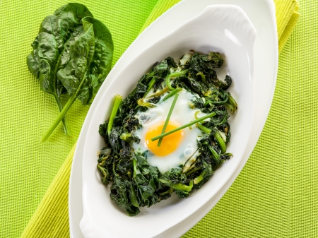 egg over boiled spinachの写真素材