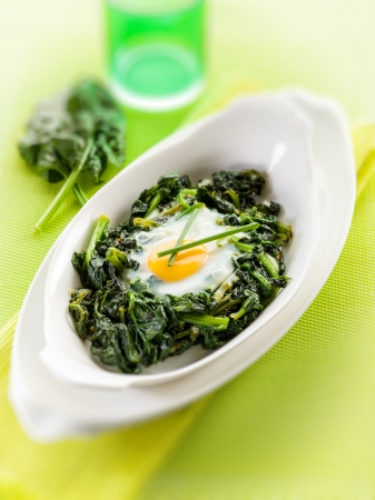 egg over boiled spinach, selective focusの写真素材
