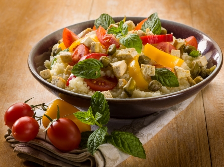 vegetarian couscous with tofu capsicum tomatoes mint and capersの写真素材