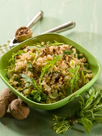 risotto with arugula and nuts, vegetarian foodの写真素材