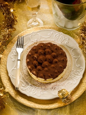 tiramisu over golden tableの写真素材