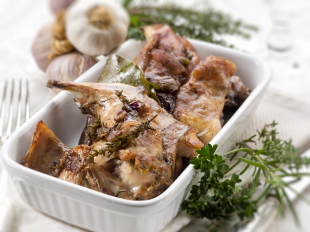 roasted rabbit with herbs and garlic, selective focusの写真素材