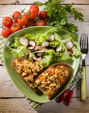 slice bread with chicken and mixed saladの写真素材