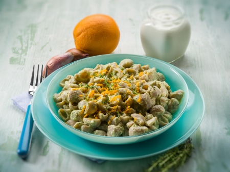 pasta with artichoke cream and orange peel, selective focusの写真素材